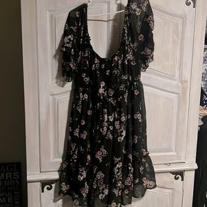 Black dress with flowers. Do not fit.